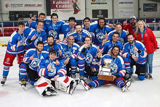The Newcastle Northstars East Coast Super League team celebrate on home ice with the championship trophy.