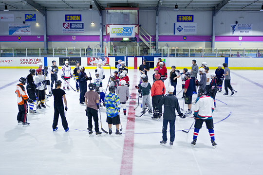 Participants receiving instruction at the Learn to Play hockey school.