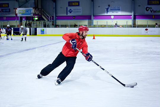 Participants receiving instruction at the Learn to Play hockey school.