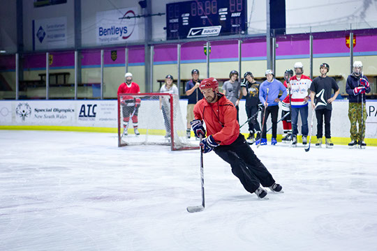 Participants receiving instruction at the Learn to Play hockey school.